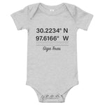 Tesla inspired apparel. Texas Gigafactory GPS coordinates. Birthplace Texas image centered on baby onesie.