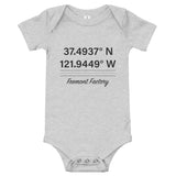 Tesla inspired apparel. Fremont Gigafactory GPS coordinates. Birthplace Fremont image centered on baby onesie.