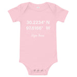 Tesla inspired apparel. Texas Gigafactory GPS coordinates. Birthplace Texas image centered on baby onesie.