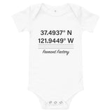 Tesla inspired apparel. Fremont Gigafactory GPS coordinates. Birthplace Fremont image centered on baby onesie.