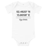 Tesla inspired apparel. Berlin Gigafactory GPS coordinates. Birthplace Berlin image centered on baby onesie.