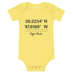 Tesla inspired apparel. Texas Gigafactory GPS coordinates. Birthplace Texas image centered on baby onesie.