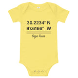 Tesla inspired apparel. Texas Gigafactory GPS coordinates. Birthplace Texas image centered on baby onesie.