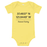 Tesla inspired apparel. Fremont Gigafactory GPS coordinates. Birthplace Fremont image centered on baby onesie.