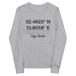 Tesla inspired apparel. Berlin Gigafactory GPS coordinates. Birthplace Berlin image centered on youth long sleeve t-shirt.