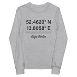 Tesla inspired apparel. Berlin Gigafactory GPS coordinates. Birthplace Berlin image centered on youth long sleeve t-shirt.